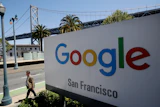 Google San Francisco sign with Bay Bridge visible in background