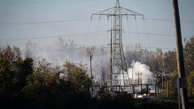 A plume of smokes rises from MC Tank Transport Inc., Toledo, Ohio, Oct. 21, 2026.