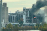 In this image from video, fire and smoke rise from a building attached to Quaker Oats facility in Cedar Rapids, Iowa.