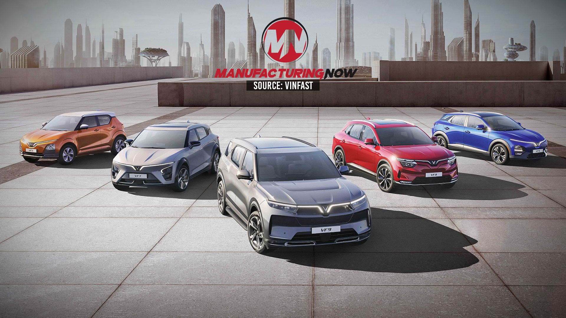 Five VinFast electric vehicles displayed on a rooftop with city skyline backdrop and Manufacturing Now branding