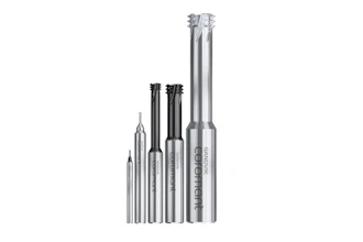 Sandvik precision cutting tools and end mills arranged in ascending size order