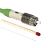 Fiber optic connector with green cable, metallic coupling nut, and ceramic ferrule tip displayed with applicator tools